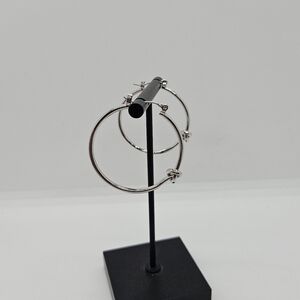 silver tone knotted hoop earrings